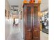 Bright hallway with a large wooden cabinet and view into the living room at 893 Barn Owl Ct. # 893, Myrtle Beach, SC 29579