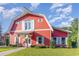 Red barn-style community clubhouse with white accents at 893 Barn Owl Ct. # 893, Myrtle Beach, SC 29579