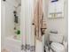 Bathroom with shower/tub combo, toilet, and linen storage at 893 Barn Owl Ct. # 893, Myrtle Beach, SC 29579