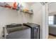 Laundry room with washer, dryer, and storage shelves at 893 Barn Owl Ct. # 893, Myrtle Beach, SC 29579