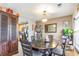 Dining room featuring a dark wood table and chairs, and convenient access to the kitchen at 893 Barn Owl Ct. # 893, Myrtle Beach, SC 29579