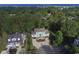 Aerial view of a teal home with ocean views and surrounding properties at 119 Cockle Shell Ct., Pawleys Island, SC 29585