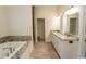 Bathroom with a large soaking tub and double vanity at 119 Cockle Shell Ct., Pawleys Island, SC 29585