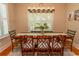 Bright dining room with a farmhouse table and chic lighting fixture at 119 Cockle Shell Ct., Pawleys Island, SC 29585