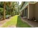Spacious backyard with grassy area and palm trees at 119 Cockle Shell Ct., Pawleys Island, SC 29585