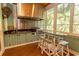 Outdoor kitchen with stainless steel appliances and a built-in grill at 119 Cockle Shell Ct., Pawleys Island, SC 29585