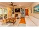 Spacious living room with a fireplace, built-in shelving, and hardwood floors at 119 Cockle Shell Ct., Pawleys Island, SC 29585