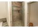 Walk-in shower with pebble floor and glass door at 119 Cockle Shell Ct., Pawleys Island, SC 29585