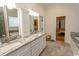 Primary bathroom with double sinks and a large shower at 119 Cockle Shell Ct., Pawleys Island, SC 29585