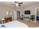 Spacious bedroom with a large TV and comfortable seating area at 119 Cockle Shell Ct., Pawleys Island, SC 29585