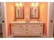 Double vanity bathroom with a coral-colored wall at 119 Cockle Shell Ct., Pawleys Island, SC 29585