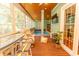 Relaxing indoor pool area with seating and a TV at 119 Cockle Shell Ct., Pawleys Island, SC 29585