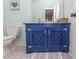 Bathroom with a stylish blue vanity and a modern toilet at 119 Cockle Shell Ct., Pawleys Island, SC 29585