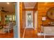 Hallway with wood walls, hardwood floors, and access to other rooms at 119 Cockle Shell Ct., Pawleys Island, SC 29585