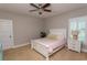 Charming bedroom with a white bed and plenty of natural light at 119 Cockle Shell Ct., Pawleys Island, SC 29585
