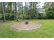 Landscaped fire pit area in backyard at 119 Cockle Shell Ct., Pawleys Island, SC 29585