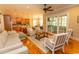 Open living room showcasing hardwood floors, comfy seating, and a view into the kitchen at 119 Cockle Shell Ct., Pawleys Island, SC 29585