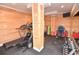 Basement home gym with wood walls and equipment at 119 Cockle Shell Ct., Pawleys Island, SC 29585