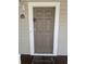 Simple brown door with white frame and welcome mat at 5801 Oyster Catcher Dr. # 1531, North Myrtle Beach, SC 29582