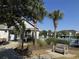 Community pool with palm trees and lounge chairs at 5801 Oyster Catcher Dr. # 1531, North Myrtle Beach, SC 29582