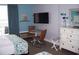 Living room with a small table and chairs, TV, and dresser at 9550 Shore Dr. # 1405, Myrtle Beach, SC 29572