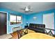 Living room with a sofa, small table, and entryway at 120 North Dogwood Dr. # 113, Garden City Beach, SC 29576