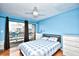 Bedroom with a bed, dresser, and access to balcony at 120 North Dogwood Dr. # 113, Garden City Beach, SC 29576