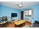 Living area with a TV, table, and access to balcony at 120 North Dogwood Dr. # 113, Garden City Beach, SC 29576