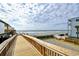 Convenient boardwalk access to a pristine sandy beach at 120 North Dogwood Dr. # 113, Garden City Beach, SC 29576