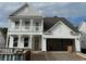 Two-story home with white siding, gray accents, and a two-car garage at 5459 Shelly Lynn Dr., Myrtle Beach, SC 29579