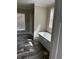 Bathroom boasts a large soaking tub and dark wood floors at 8750 W Highway 19, Loris, SC 29569