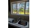 Kitchen sink with a large window overlooking the backyard at 8750 W Highway 19, Loris, SC 29569