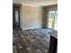 Dining area with gray wood-look flooring and access to the kitchen at 8750 W Highway 19, Loris, SC 29569