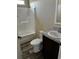 Bathroom with tub, toilet, vanity, and dark floors at 8750 W Highway 19, Loris, SC 29569
