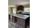Modern kitchen boasting a spacious island with granite countertops at 8750 W Highway 19, Loris, SC 29569
