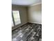 Bright living room with wood-look floors and large windows at 8750 W Highway 19, Loris, SC 29569