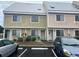 Two-story townhome with light green and pink exterior at 1210 Pinegrove Dr. # G, Myrtle Beach, SC 29577