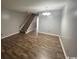 Dining room with wood floors and view to staircase at 1210 Pinegrove Dr. # G, Myrtle Beach, SC 29577