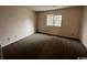 Simple bedroom with carpet flooring and a window at 1210 Pinegrove Dr. # G, Myrtle Beach, SC 29577