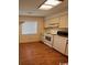 Efficient kitchen with white appliances and wood floors at 1210 Pinegrove Dr. # G, Myrtle Beach, SC 29577