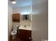 Clean bathroom with toilet, sink, and vanity at 1210 Pinegrove Dr. # G, Myrtle Beach, SC 29577