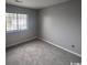 Spacious bedroom with grey walls and carpet flooring at 1210 Pinegrove Dr. # G, Myrtle Beach, SC 29577