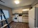 Updated kitchen with white appliances and wood floors at 1210 Pinegrove Dr. # G, Myrtle Beach, SC 29577