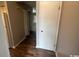 Clean hallway with light walls and wood flooring at 1210 Pinegrove Dr. # G, Myrtle Beach, SC 29577