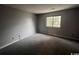 Simple bedroom with neutral carpeting and a window offering natural light at 1210 Pinegrove Dr. # G, Myrtle Beach, SC 29577