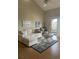 Living room with L-shaped sofa and access to balcony at 501 Maison Dr. # G15, Myrtle Beach, SC 29572