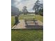 Brick paved picnic area with a table and grill at 501 Maison Dr. # G15, Myrtle Beach, SC 29572