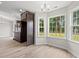 Bright dining area with large windows and luxury vinyl plank flooring at 326 Barn Owl Way, Conway, SC 29527