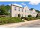 Tan three-story townhome with multiple windows and landscaping at 4541 Girvan Dr. # 27-D, Myrtle Beach, SC 29579