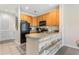 Modern kitchen with wood cabinets and stainless steel appliances at 4541 Girvan Dr. # 27-D, Myrtle Beach, SC 29579